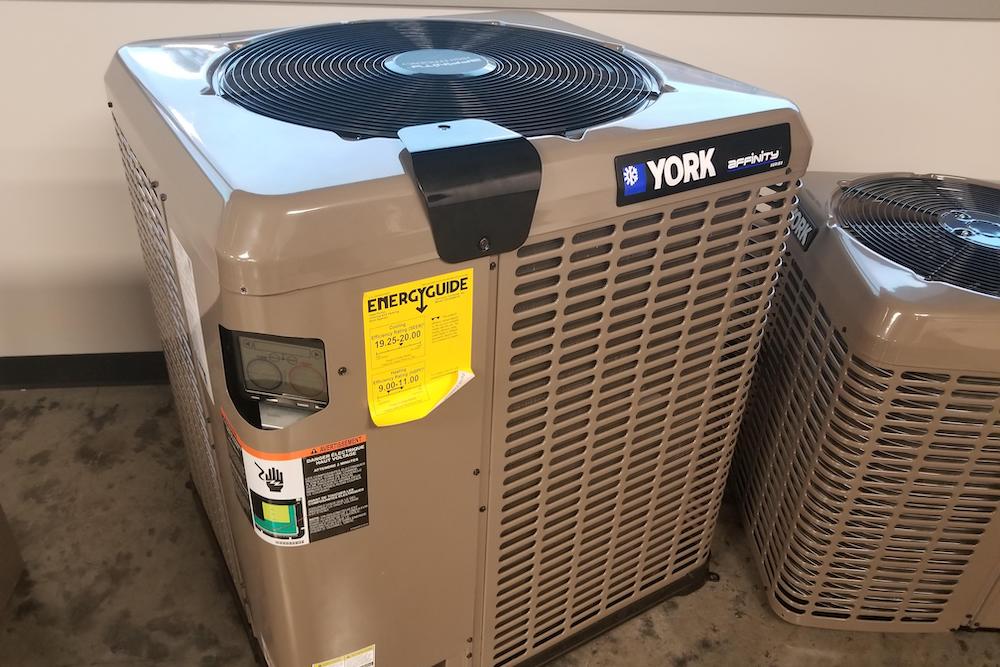 A york air conditioner sitting on top of the floor.