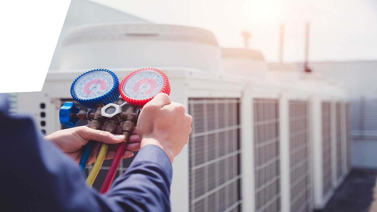 A person is working on an air conditioner.